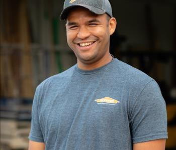 Male in grey t-shirt with ball cap